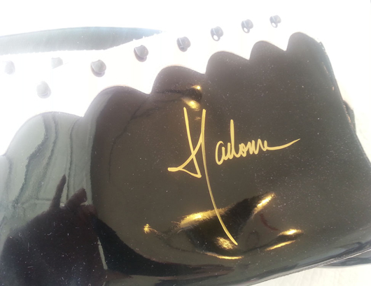 Madonna signed boots. Solid Ground image.